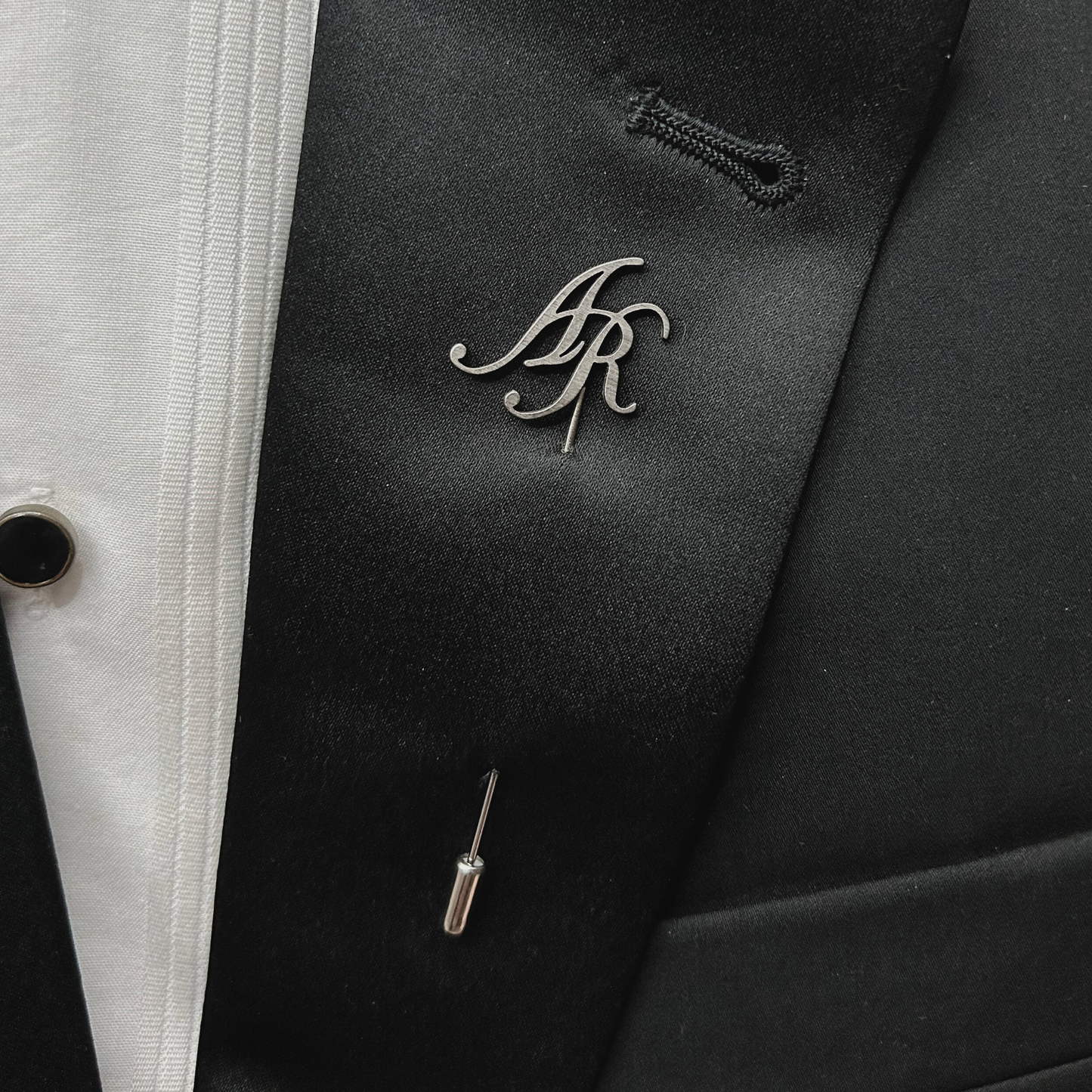 Boutonnier personalizado en acero inoxidable