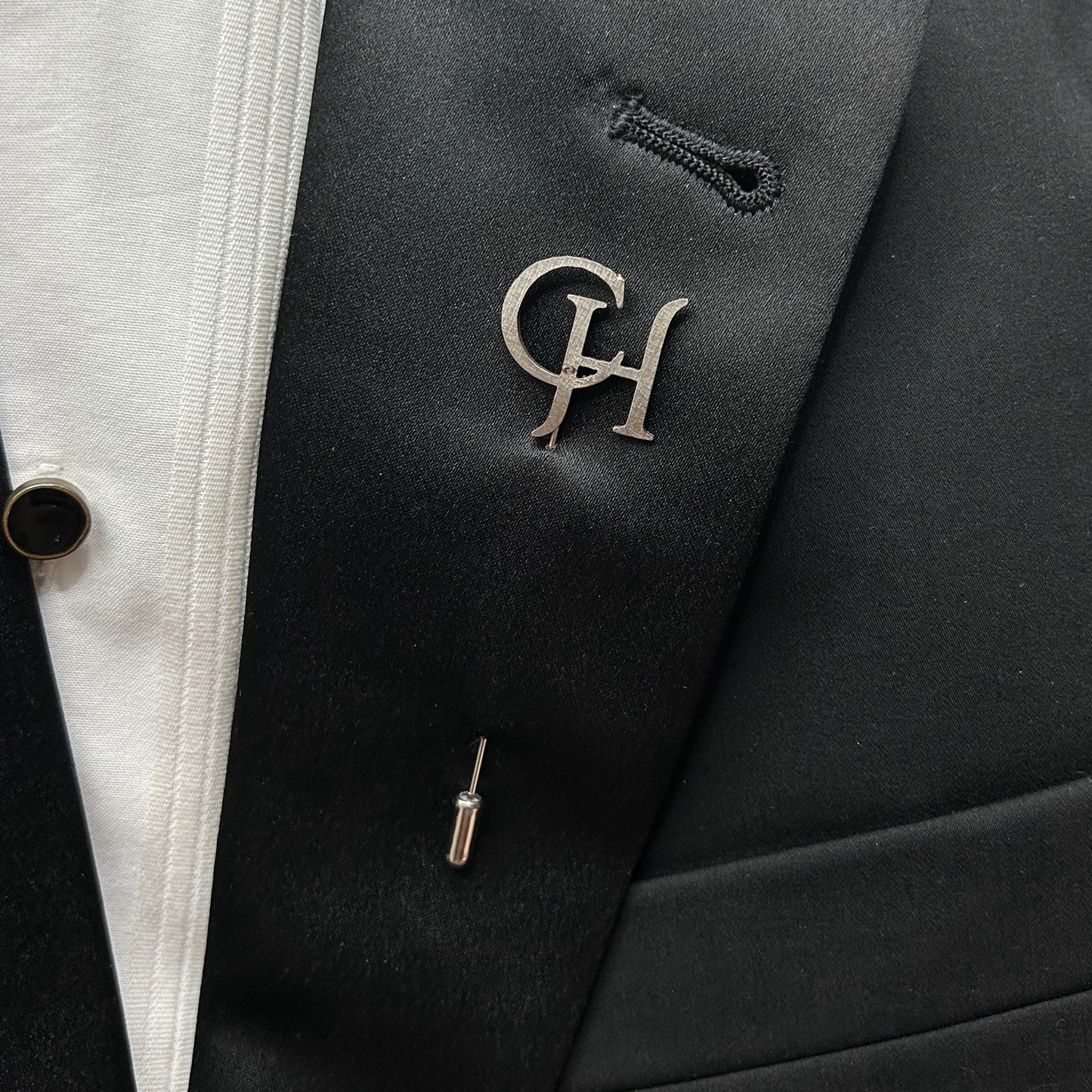 Boutonnier personalizado en acero inoxidable