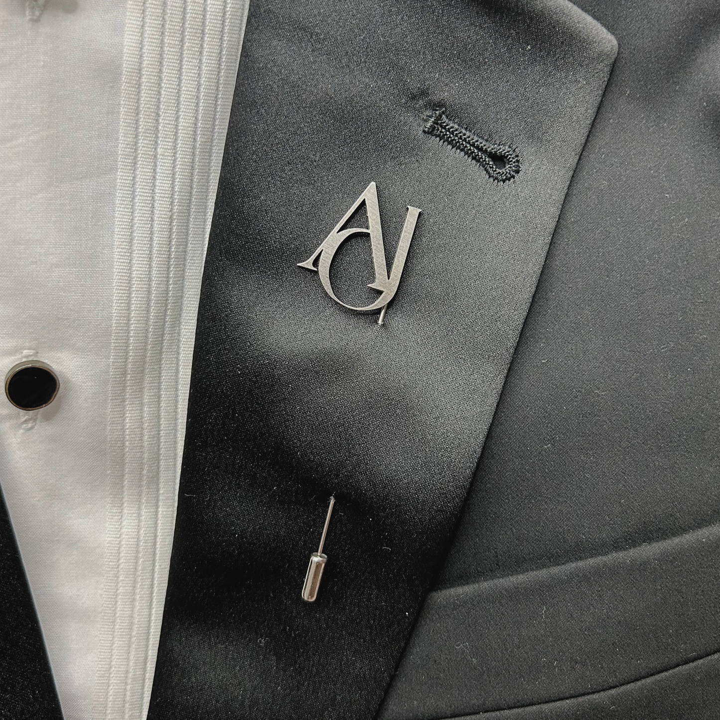 Boutonnier personalizado en acero inoxidable